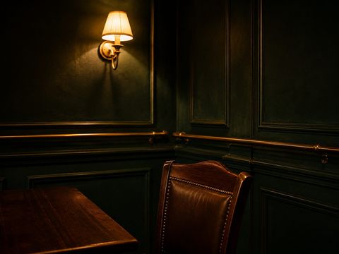 Green panelling and brass rail in the pub